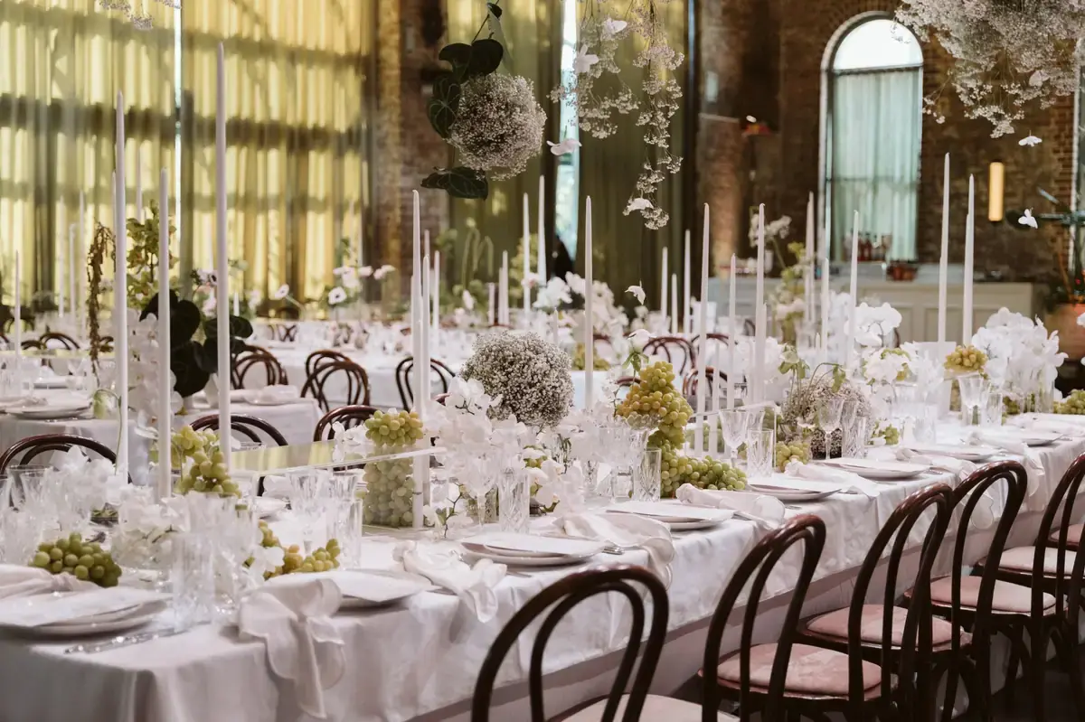 Elegant wedding table styling with white florals, candles and grapes at Linseed House venue